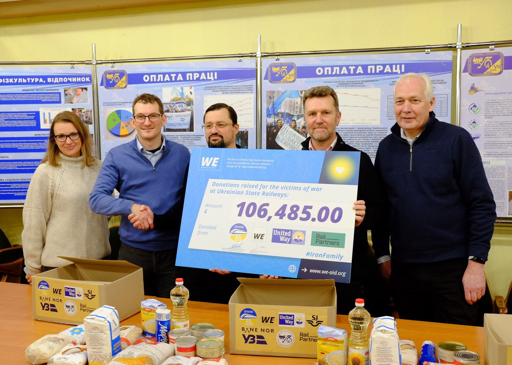 Andy Bagnall, Steve Montgomery and David Brown present cheque with donation amount raised by Rail Partners to Ukrainian Railways
